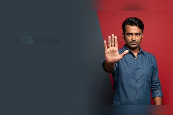 Serious Man Gesturing Stop on Red and Gray Background