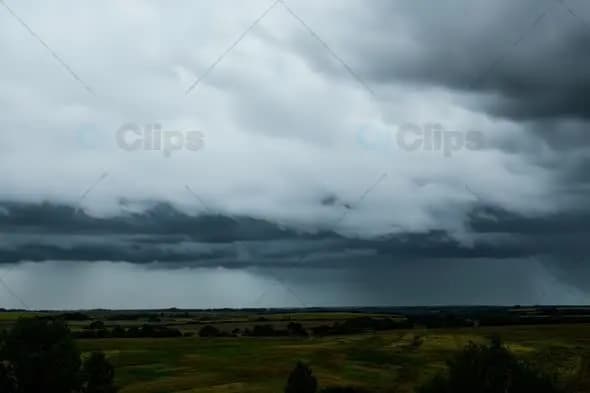 Dramatic Storm Clouds Rolling Over Rural Landscape