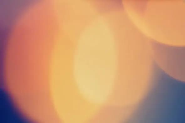 Abstract Golden Bokeh Lights on Deep Blue Background