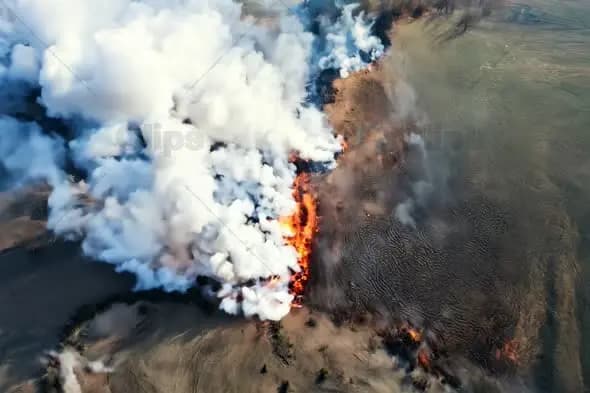 Aerial View of Active Volcanic Eruption with Smoke and Lava Flow