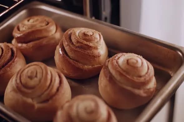 Freshly Baked Cinnamon Rolls on Metal Baking Tray