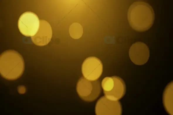 Elegant Golden Bokeh Light Effects in Motion