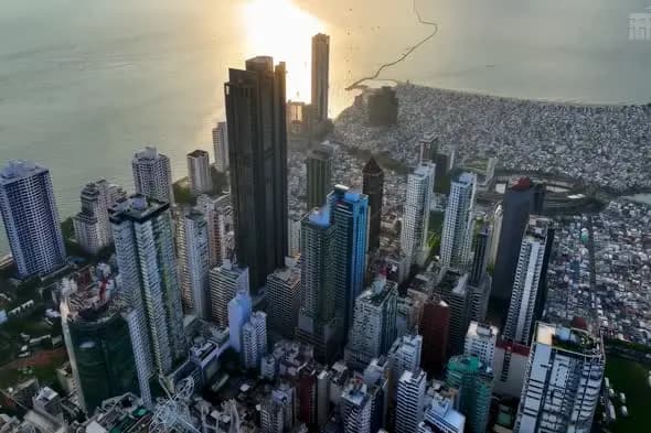 Coastal City Skyline at Golden Hour with Dense Urban Architecture