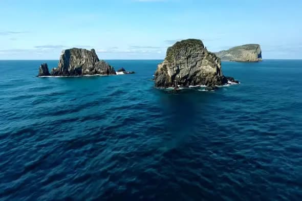 Majestic Rocky Islands Rising from Turquoise Ocean Waters