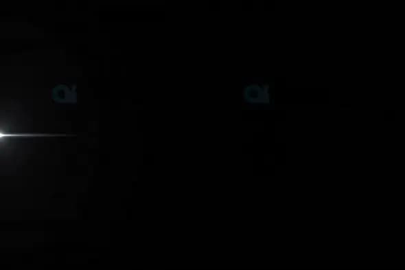 Minimalistic White Light Flare with Horizontal Streak on Dark Background
