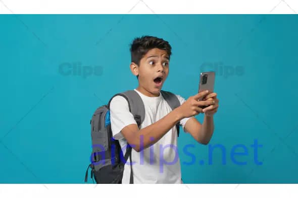 Surprised Boy Looking at Smartphone