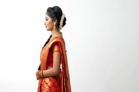 South Indian Woman in Traditional Saree with Floral Hair Braid on White Background