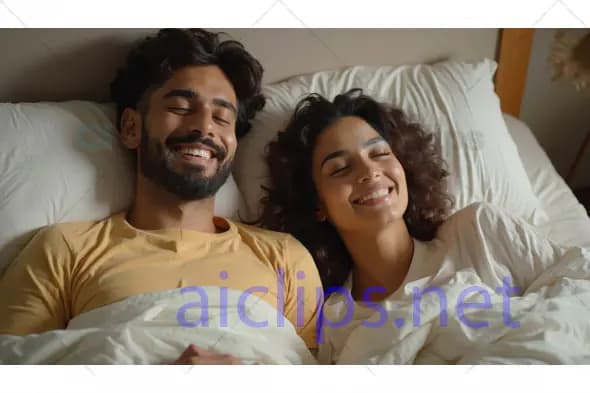 Happy Couple Relaxing in Bed