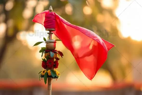 Traditional Gudi Flag with Floral Decor Waving in Sunlight
