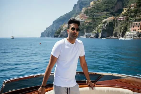 Man on Boat by the Ocean