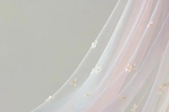 Delicate Floral Tulle Fabric with Embroidered Petals Close-up