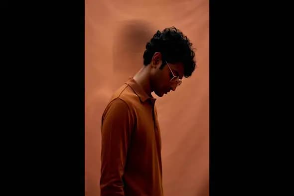 Young Man in Brown Outfit with Blurred Motion