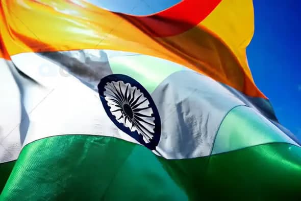 Indian National Flag Waving Against Clear Blue Sky
