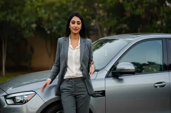 Professional Woman Beside Luxury Car