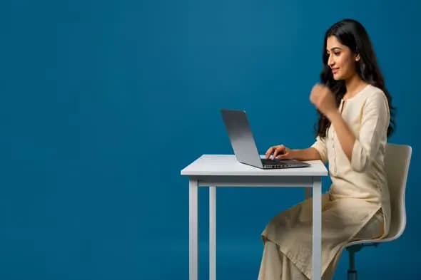 Professional Woman Working on Laptop with Success Gesture