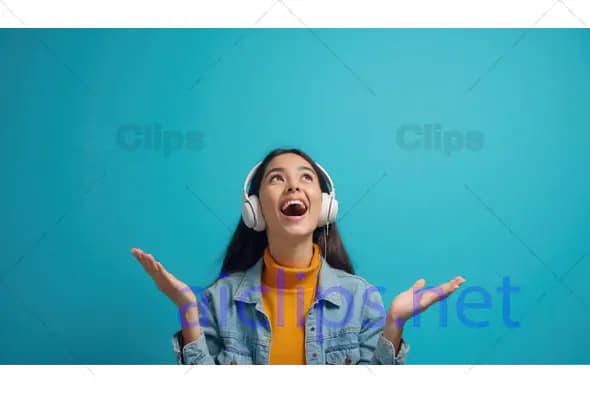 Happy Woman Listening to Music on Headphones