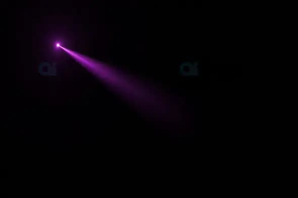 Purple Light Beam Piercing Through Dark Background