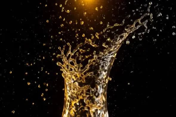 Dynamic Golden Liquid Splash Against Black Background