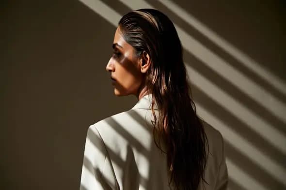 Woman with wet hair in business attire
