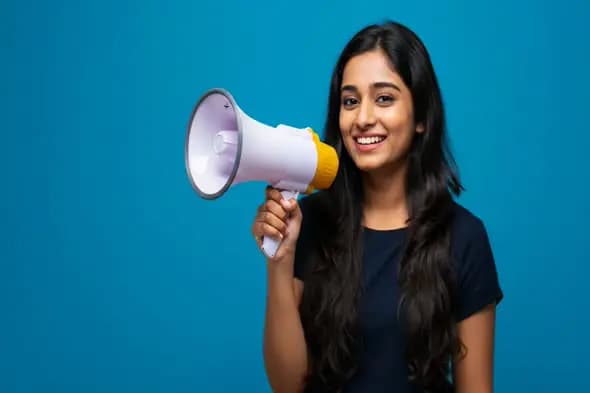 Indian Woman Announcer Holding Megaphone on Blue Background
