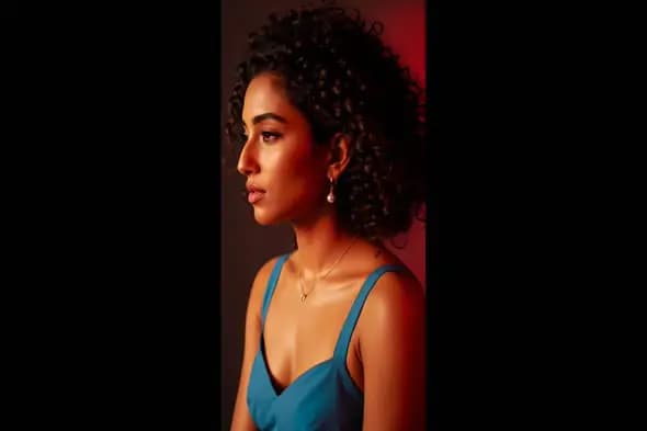 Crimson-Lit Profile of Curly-Haired Woman