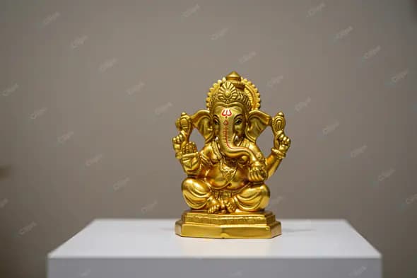 Golden Ganesha Figurine on Display