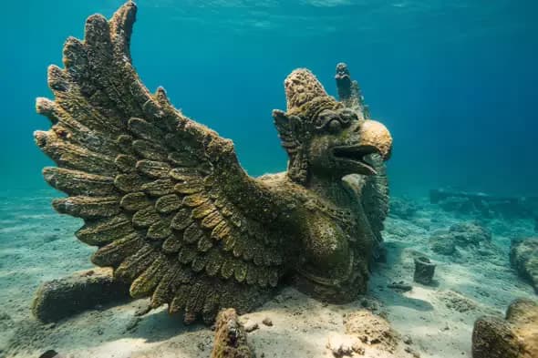 Ancient Garuda Statue Submerged in Ocean Depths