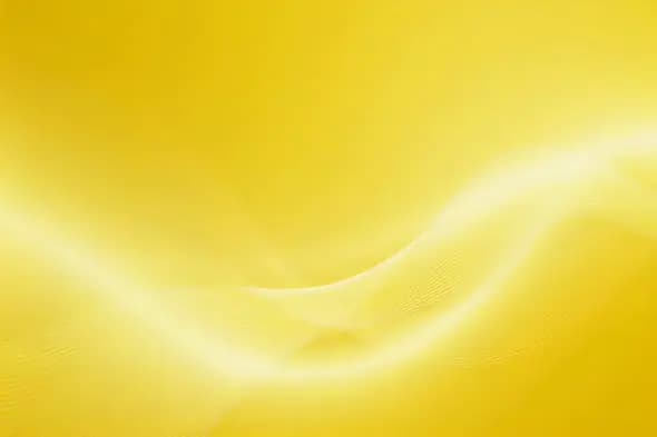 Silky golden waves flow across sunny background