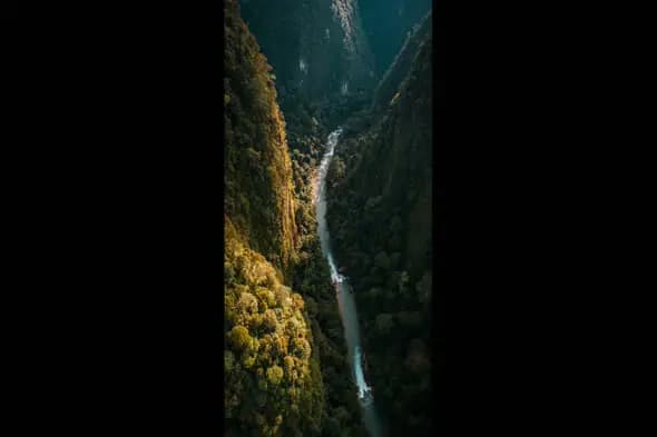Aerial View of a River Cutting Through Mountainous Terrain