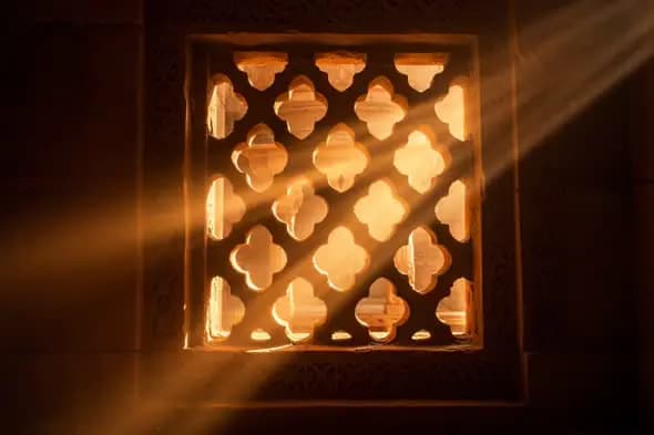 Sunlight Through Traditional Indian Jharokha Stone Window