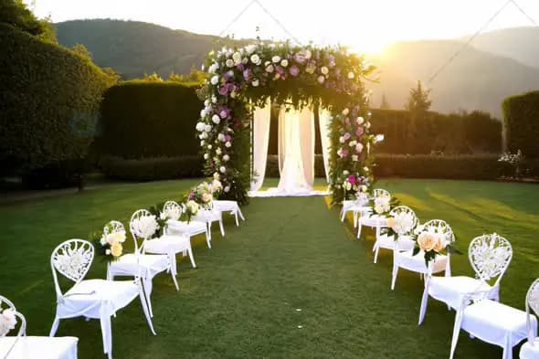 Outdoor Wedding Ceremony with Floral Arch at Sunset