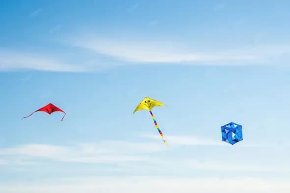 Colorful Trio of Kites Against a Clear Sky
