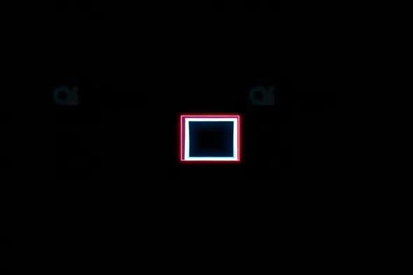 Neon Glowing Square with Red and Blue Lights on Black Background