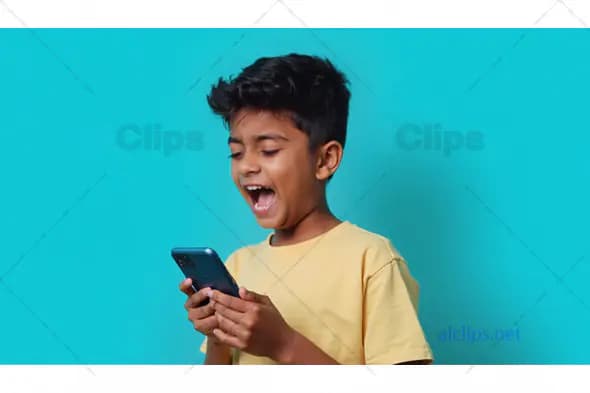 Excited Boy Playing on Smartphone