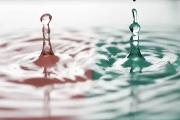 Slow Motion Water Droplet Splash with Dual Red and Green Color Effect
