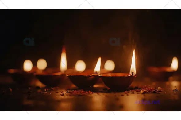 Lit Diyas in Darkness