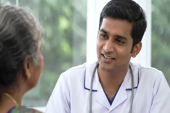 Attentive Doctor Consults Elderly Patient