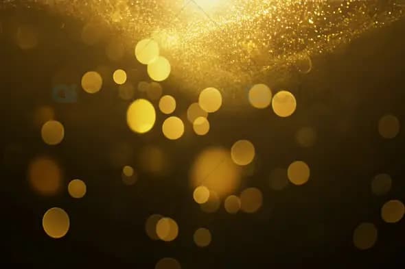 Golden Bokeh Lights Background with Glittering Particles