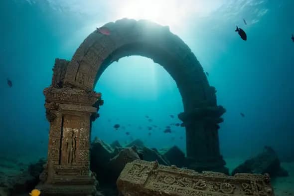 Ancient Indian Temple Archway Submerged Underwater with Sunlight Rays