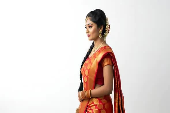 Traditional South Indian Woman in Red Bridal Saree with Jasmine Flowers