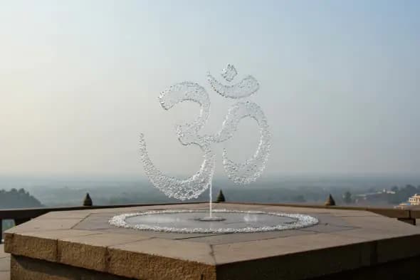 Flowing Om Symbol Water Fountain at Temple Terrace with Scenic View