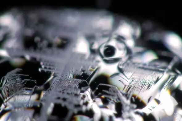 Extreme Macro Shot of Silver Metallic Surface with Light Reflections