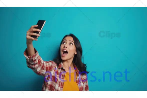 Excited Woman Taking Selfie