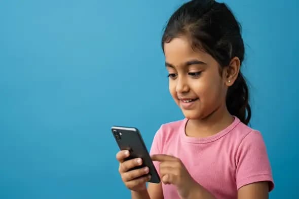 Young Girl Engrossed in Smartphone