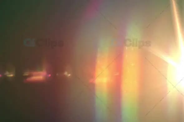 Vibrant Multicolored Light Flare with Lens Reflections and Warm Glow