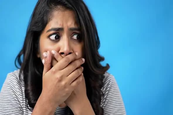 Startled Expression on Blue Background