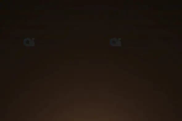 Soft Warm Light Flare Glowing from Bottom on Dark Background