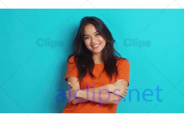 Smiling Woman in Orange T-Shirt on Blue Background