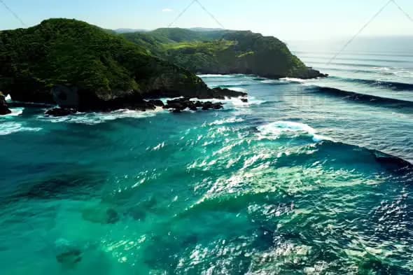 Aerial View of Pristine Turquoise Waters and Rocky Coastline