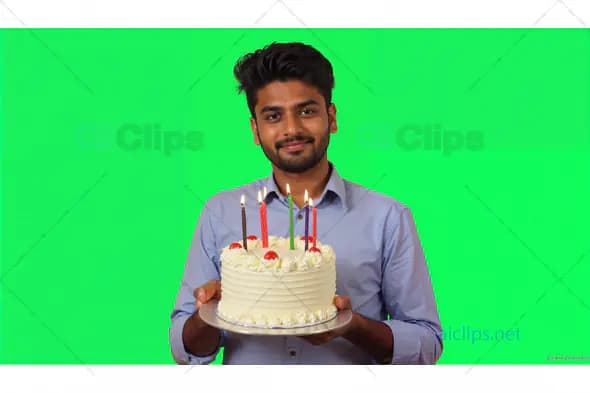Man Holding Birthday Cake with Candles